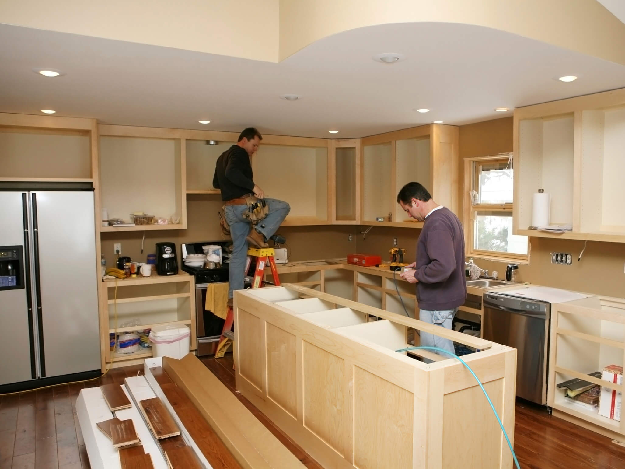 Montana home with contractors renovating kitchen